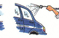 rinsing the car by spraying it with water