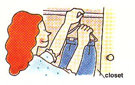 hanging clothes up in the closet