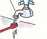 running water over toothbrush