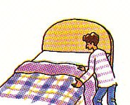 spreading a bedspread over the bed