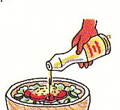 pouring dressing on the salad