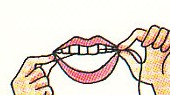 slipping floss between teeth